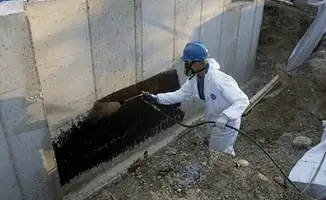 Professional waterproofing the exterior walls of the basement in Yonkers, NY