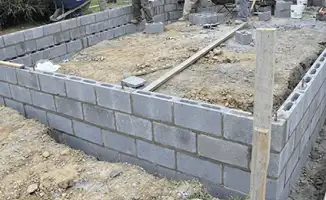 Professionals building a foundation with blocks in Yonkers, NY