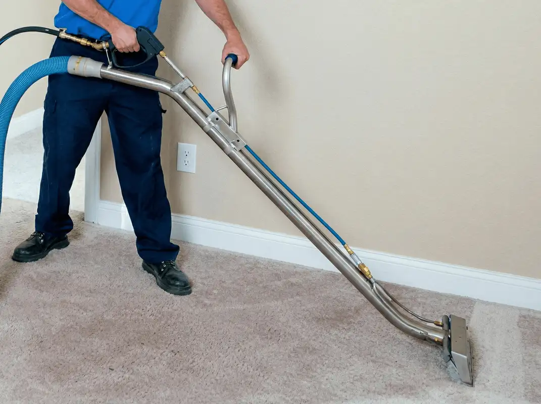 Professional operating a liquid removal machine on a carpeted floor in Yonkers, NY